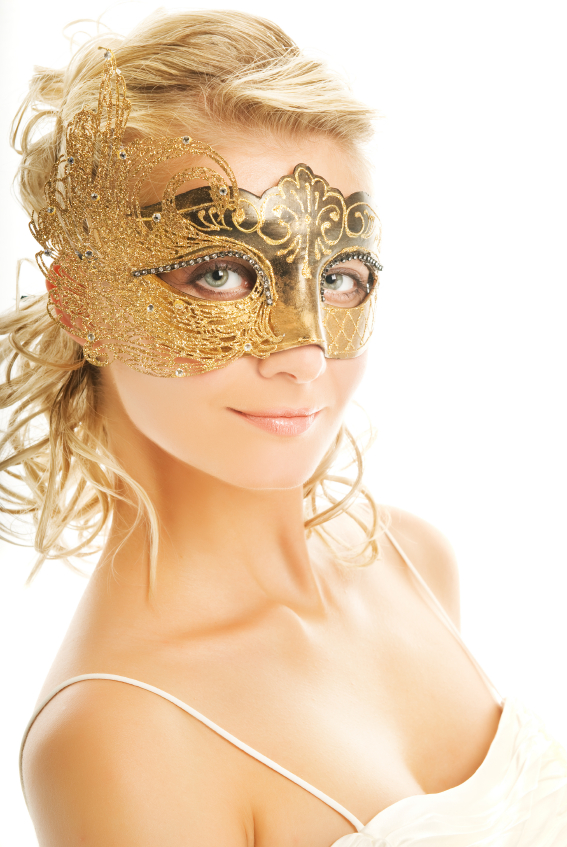 Beautiful blond woman in a golden carnival mask