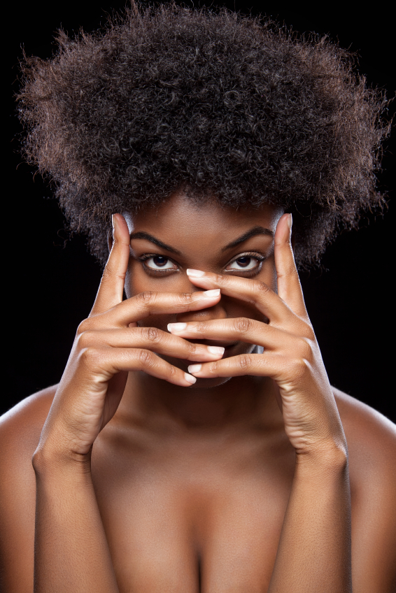African beauty covering face with hands